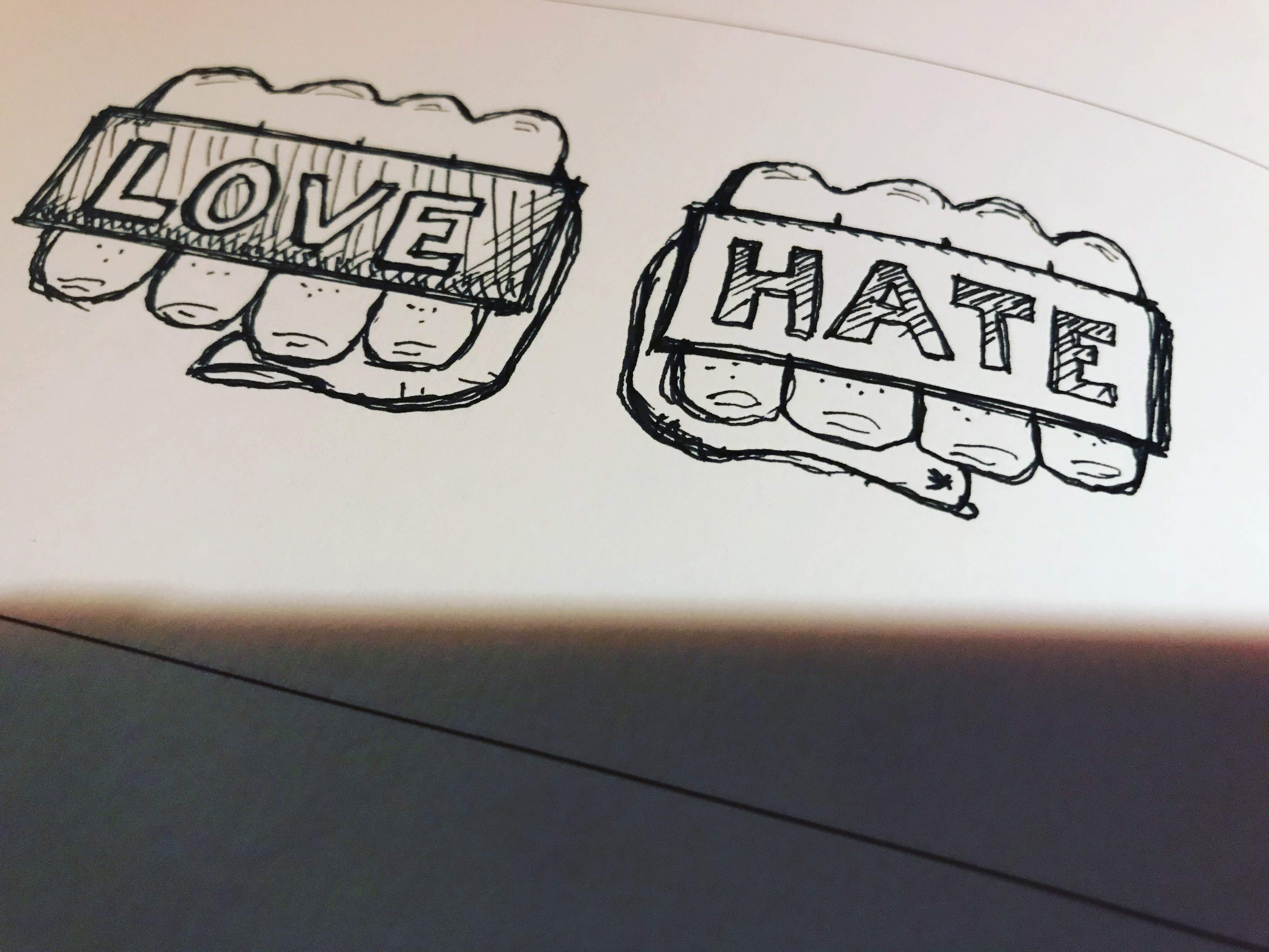 Drawing of brass knuckles reading Love and Hate